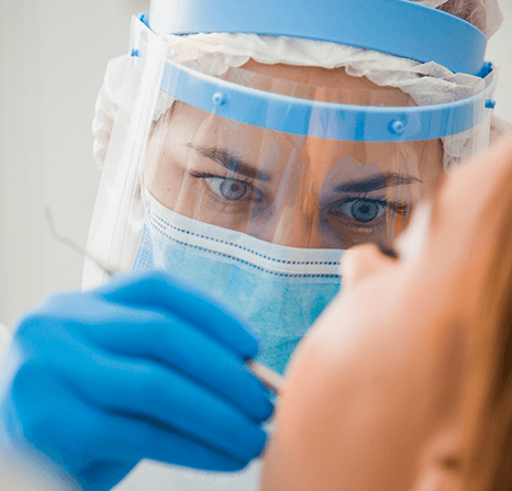 A dentist working on a patient.